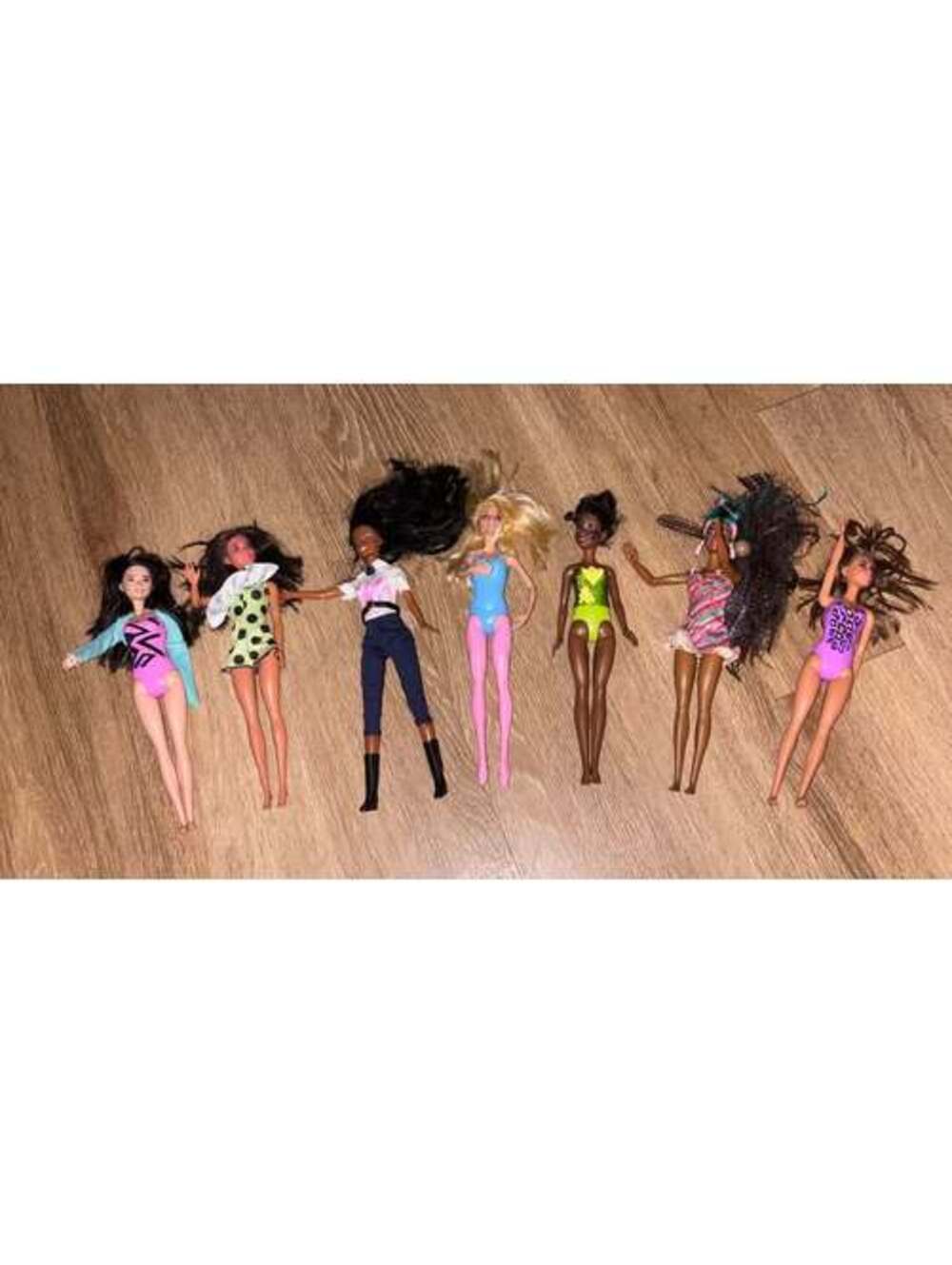 Lot of 7 Barbie Dolls and Barbie accessories